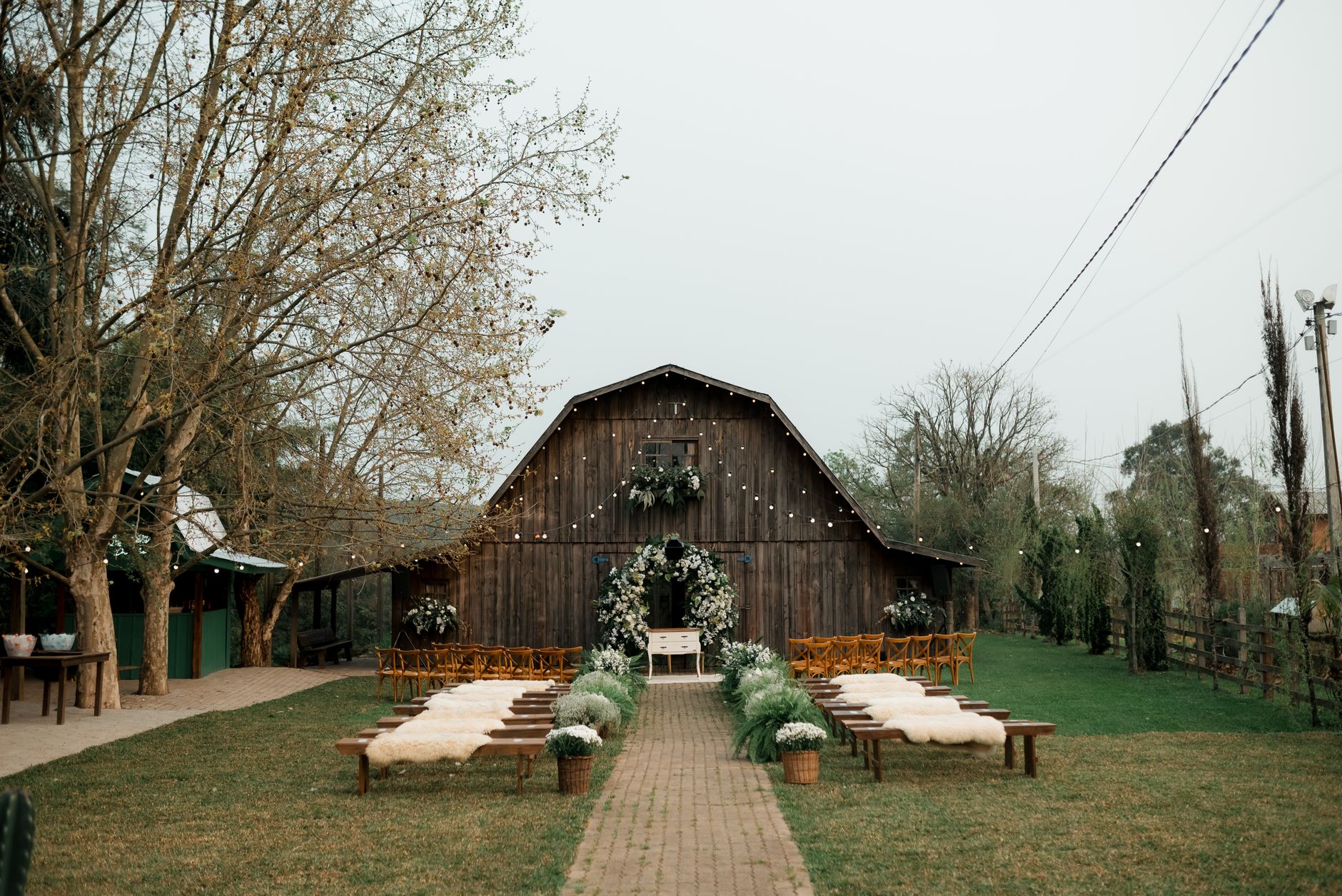Rustic outdoor wedding venue barn floral decorations